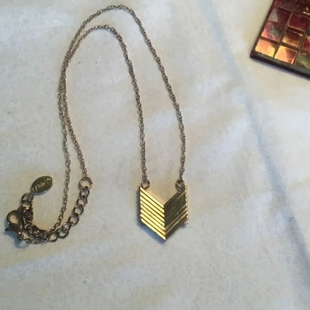 $8 or 3/$15. Goldtone Chevron Necklace